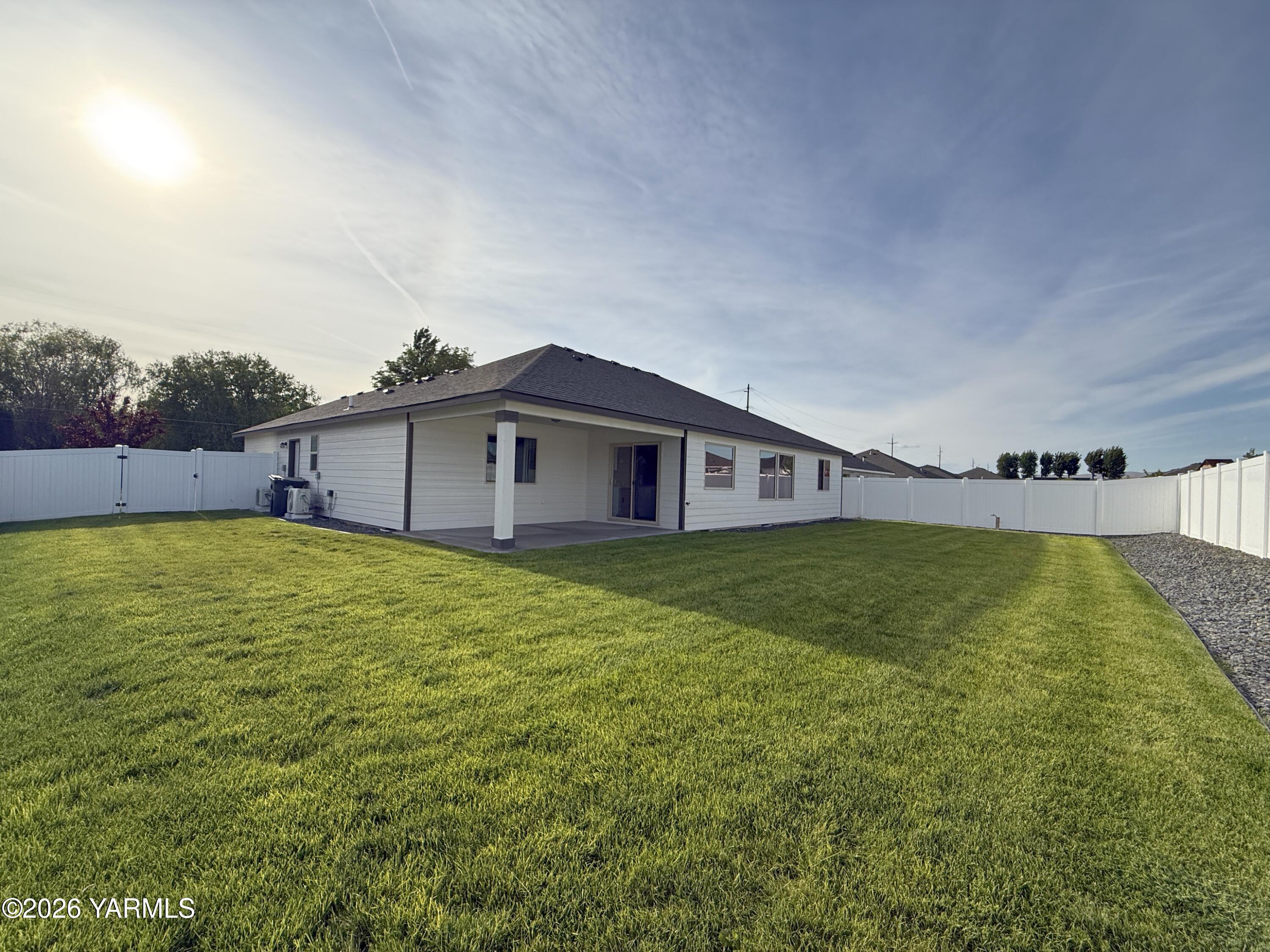 903 North Euclid Road, Unit PHASE 1 LOT 8) SPEC Grandview, WA 98930 - Photo 25 of 25 a view of an house with backyard space and balcony