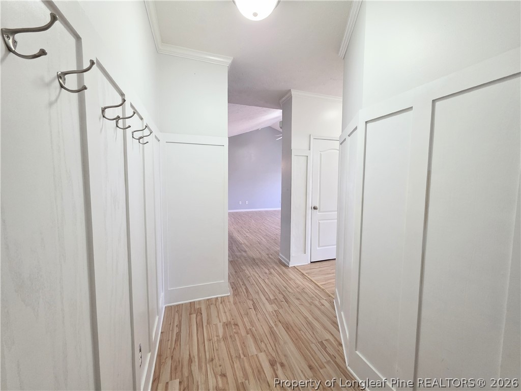 1324 Kershaw Loop, Unit 206 Fayetteville, NC 28314 - Photo 3 of 26 a view of a hallway with wooden floor and staircase