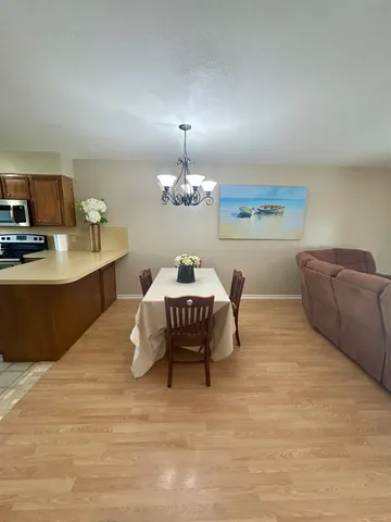 a bedroom with a bed rug and window