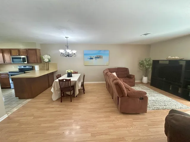 a kitchen with a stove a sink and a refrigerator