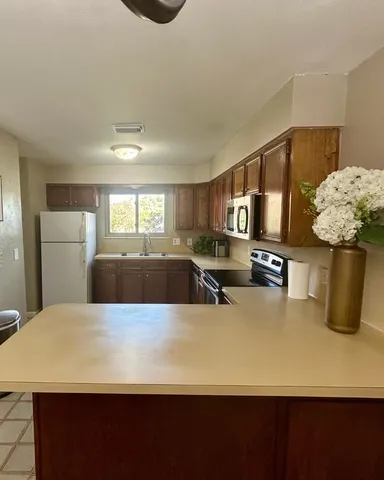 a kitchen with a stove and a microwave