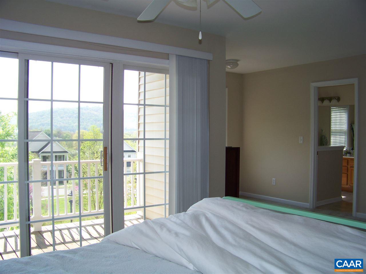 131 Burnet Street Charlottesville, VA 22902 - Photo 25 of 38 a bedroom with a bed and a large window