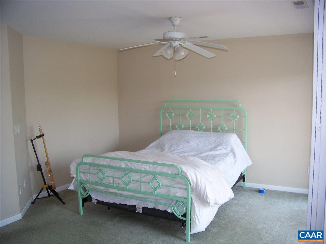 131 Burnet Street Charlottesville, VA 22902 - Photo 26 of 38 a bedroom with a bed and a chandelier