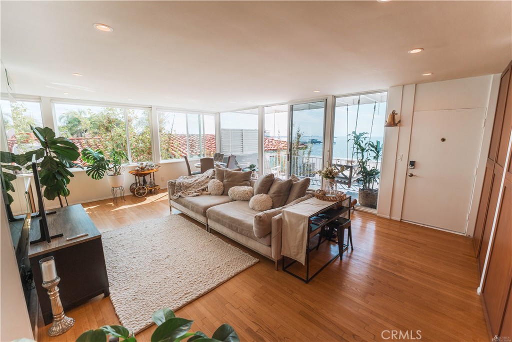 16 South 36th Place, Unit F Long Beach, CA 90803 - Photo 1 of 28 a living room with furniture and a large window
