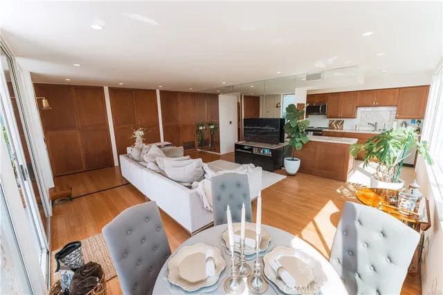 a kitchen with granite countertop a sink a counter top space and cabinets