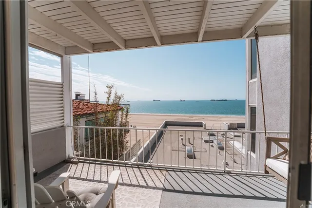 a view of balcony with wooden floor