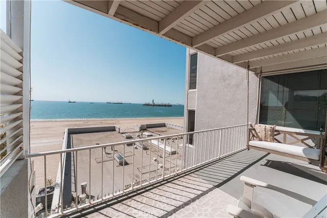 a view of a balcony with wooden floor