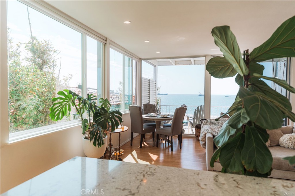 16 South 36th Place, Unit F Long Beach, CA 90803 - Photo 2 of 28 a view of a dining room with furniture window and outside view