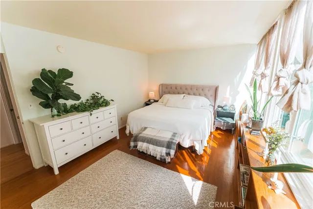 a spacious bedroom with a bed and a couch