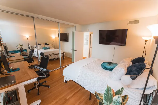 a bed room with a bed and a chair