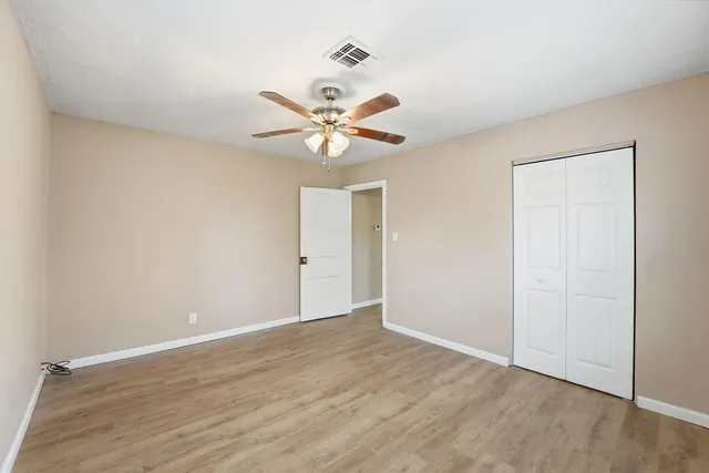 a bathroom with a bathtub sink mirror vanity and toilet