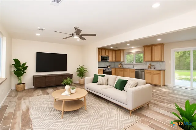 a living room with furniture and a view of living room