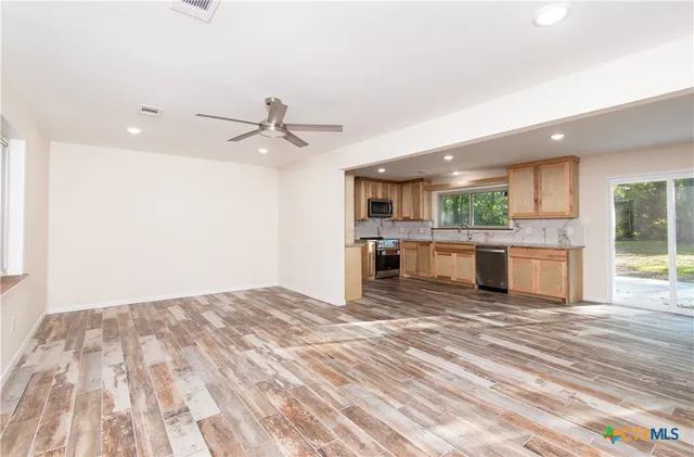 a view of kitchen with wooden floor