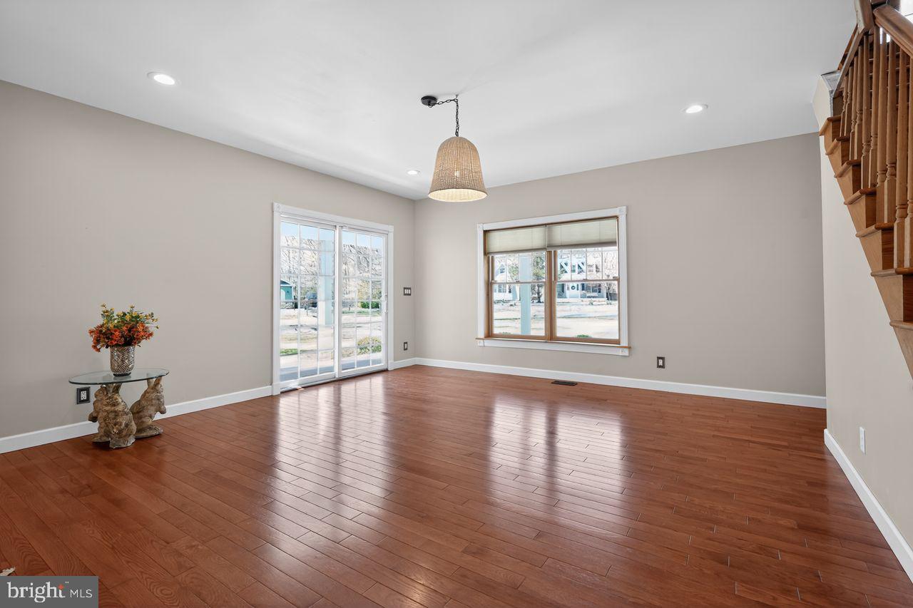 21 Mill Road Shamong, NJ 08088 - Photo 11 of 52 a view of an empty room with wooden floor and a window