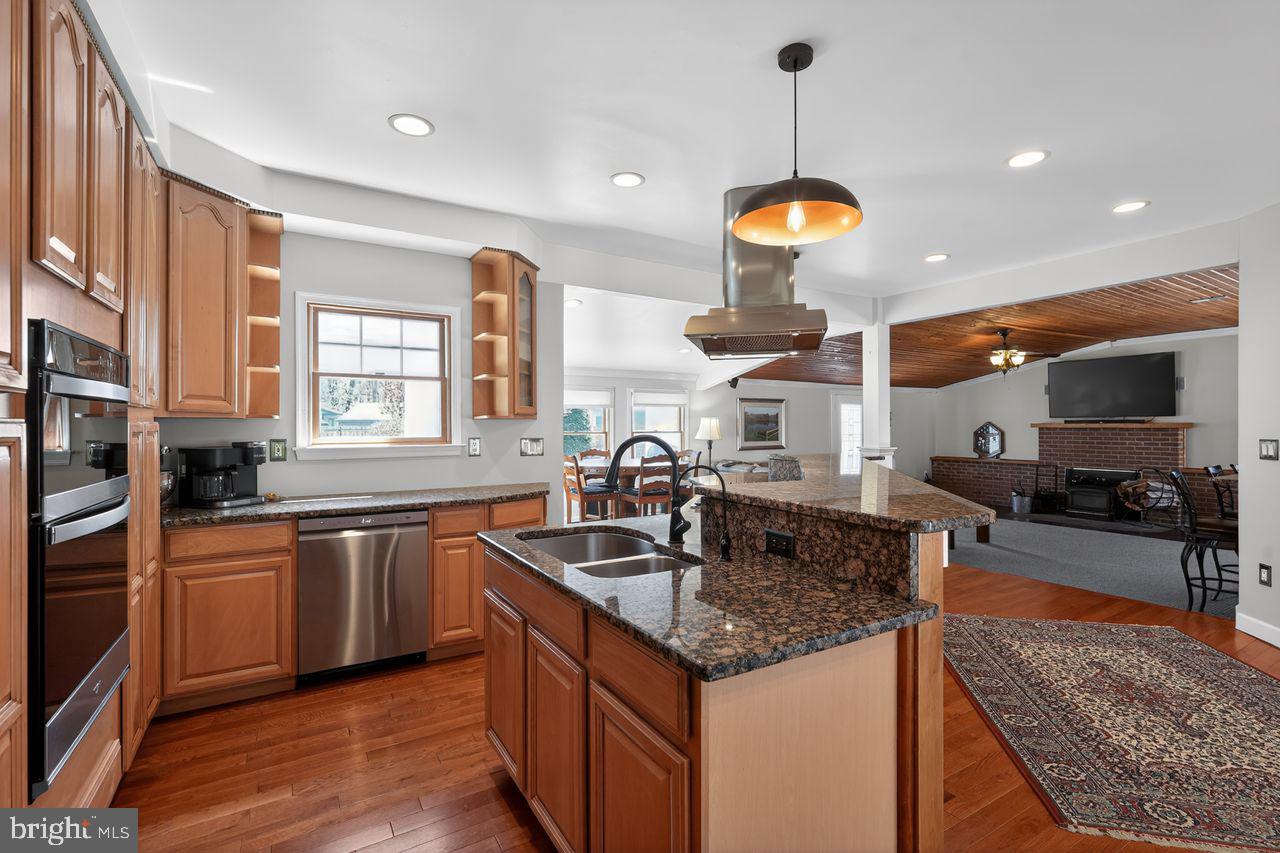 21 Mill Road Shamong, NJ 08088 - Photo 15 of 52 a kitchen with stainless steel appliances granite countertop a sink stove and refrigerator