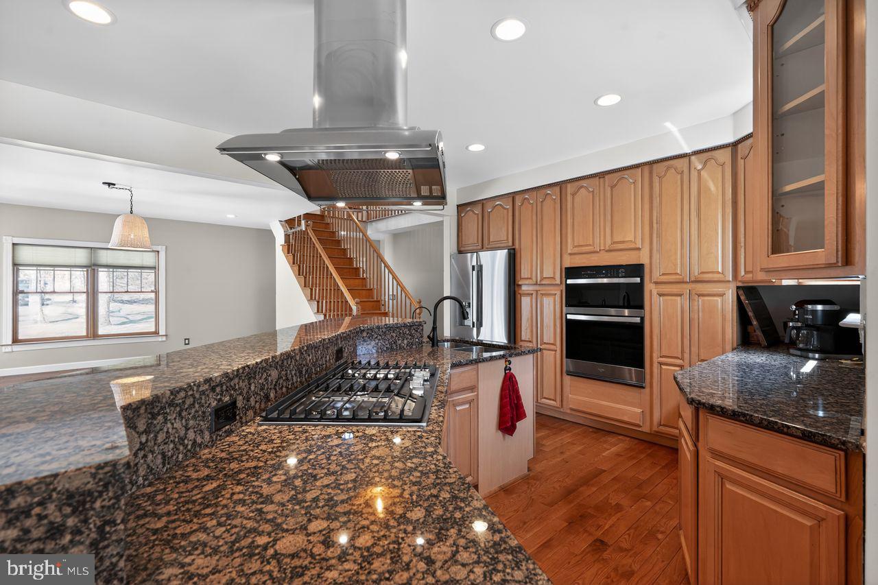 21 Mill Road Shamong, NJ 08088 - Photo 16 of 52 a kitchen with stainless steel appliances granite countertop a sink stove and refrigerator