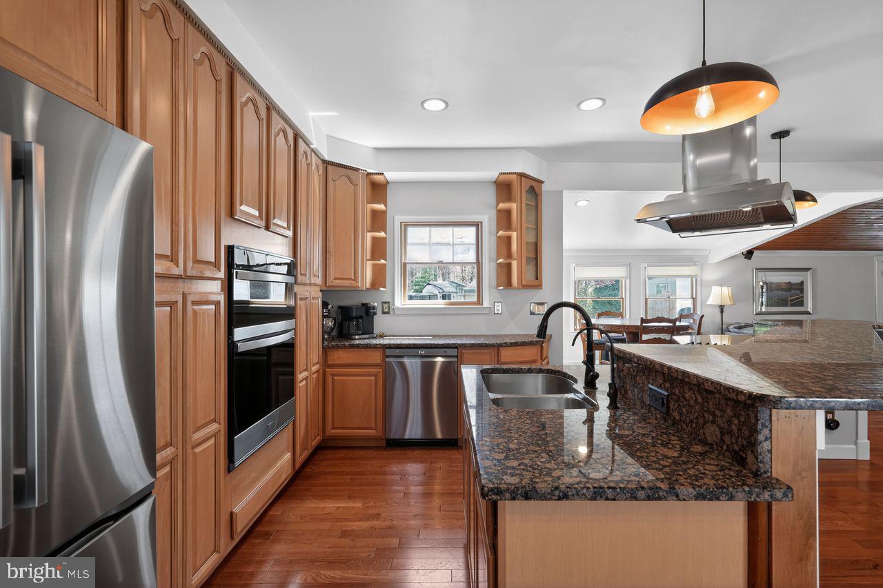 21 Mill Road Shamong, NJ 08088 - Photo 17 of 52 a kitchen with stainless steel appliances granite countertop a sink a stove and a refrigerator