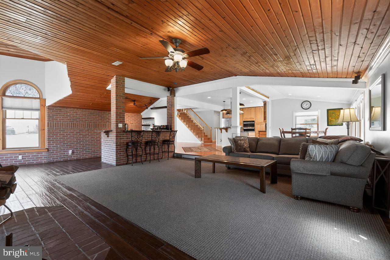 21 Mill Road Shamong, NJ 08088 - Photo 20 of 52 a living room with furniture and a chandelier