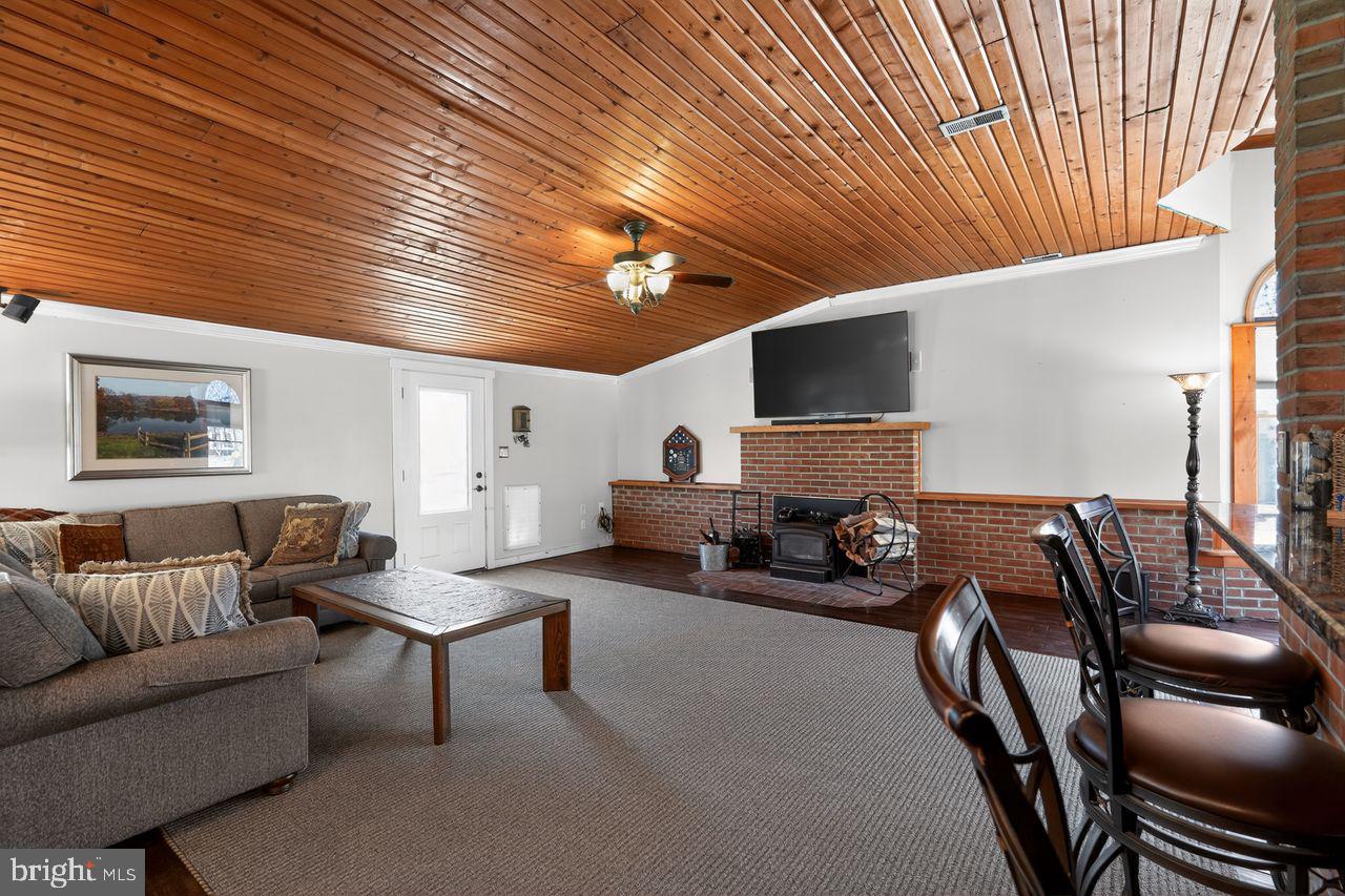 21 Mill Road Shamong, NJ 08088 - Photo 22 of 52 a living room with furniture and a flat screen tv