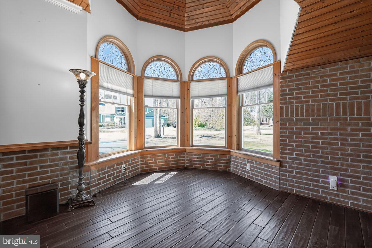 21 Mill Road Shamong, NJ 08088 - Photo 23 of 52 a view of a livingroom with wooden floor and a large window
