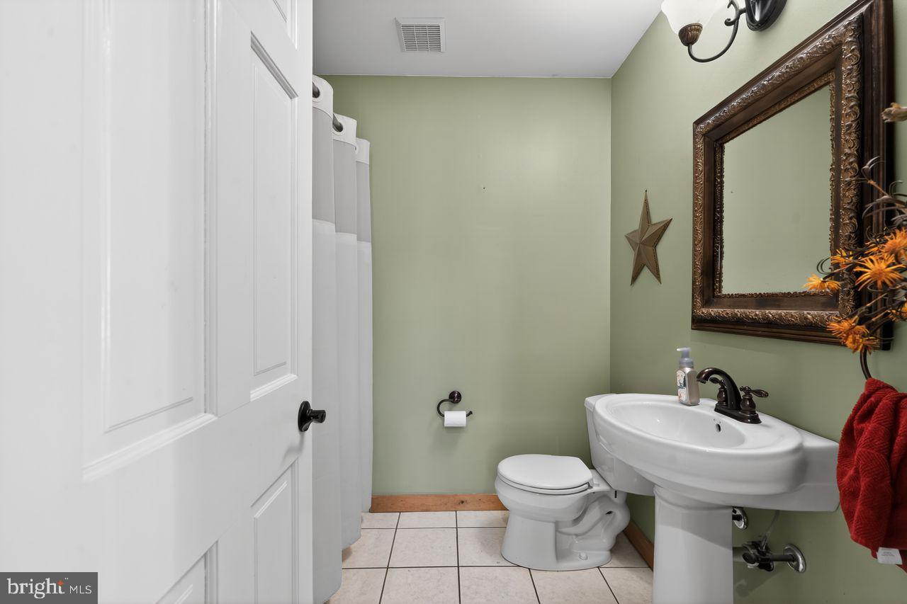 21 Mill Road Shamong, NJ 08088 - Photo 26 of 52 a bathroom with a sink toilet and a mirror