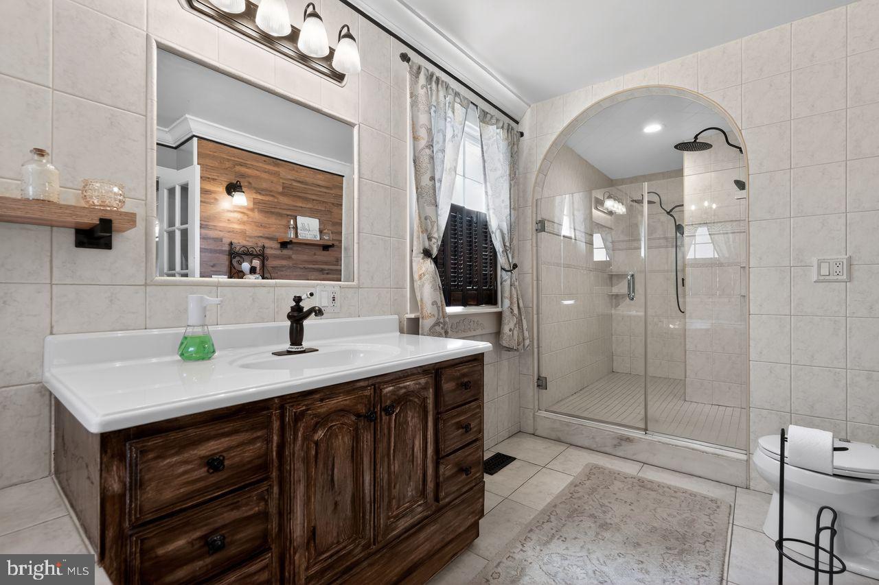 21 Mill Road Shamong, NJ 08088 - Photo 30 of 52 a bathroom with a sink vanity granite shower and a mirror