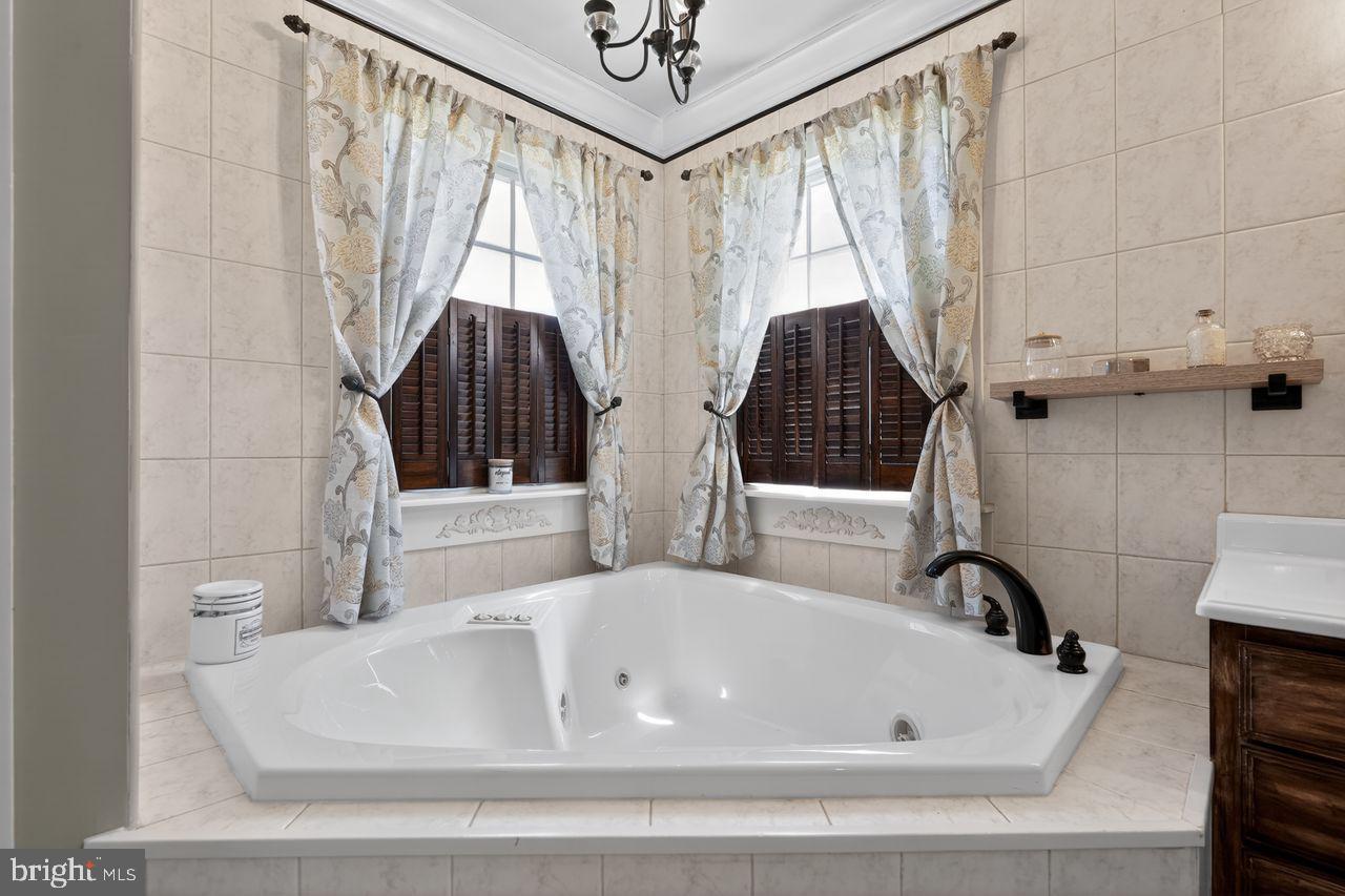 21 Mill Road Shamong, NJ 08088 - Photo 32 of 52 a bathroom with a bathtub and a shower