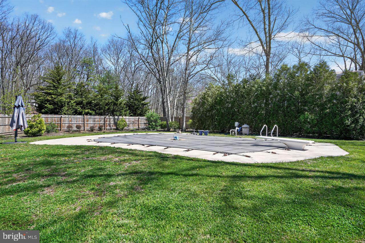 21 Mill Road Shamong, NJ 08088 - Photo 44 of 52 a swimming pool with outdoor seating and yard