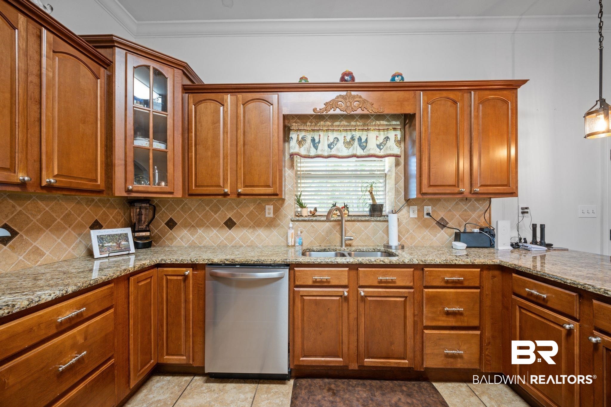 48513 Phillipsville Road Bay Minette, AL 36507 - Photo 15 of 50 Kitchen with dishwasher, crown molding, light stone countertops, glass insert cabinets, and backsplash