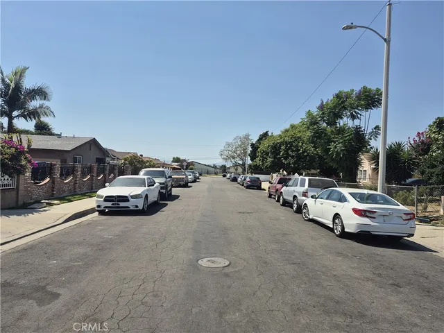 a view of street with parked cars