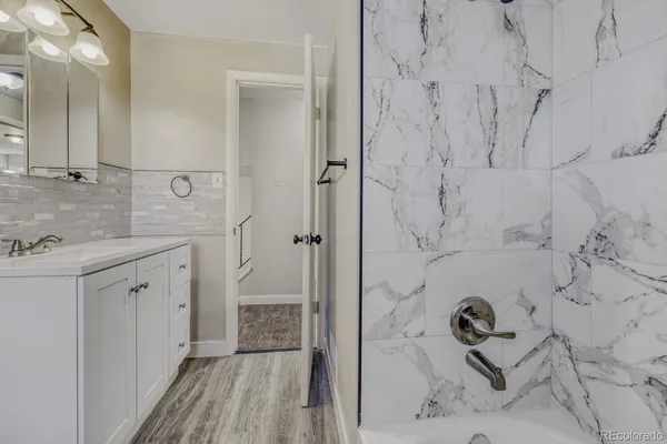 a bathroom with a sink and a mirror