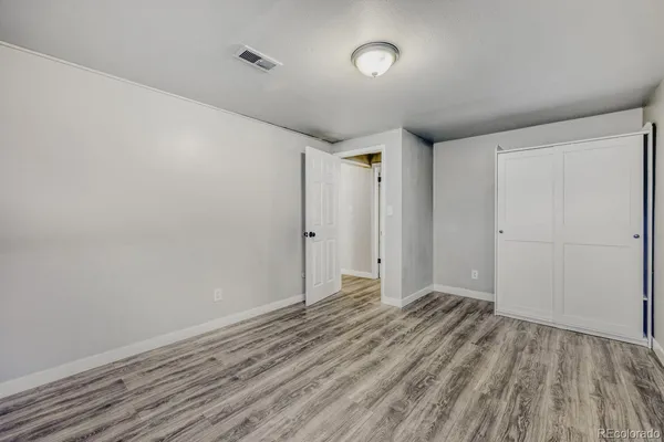 a view of room with wooden floor