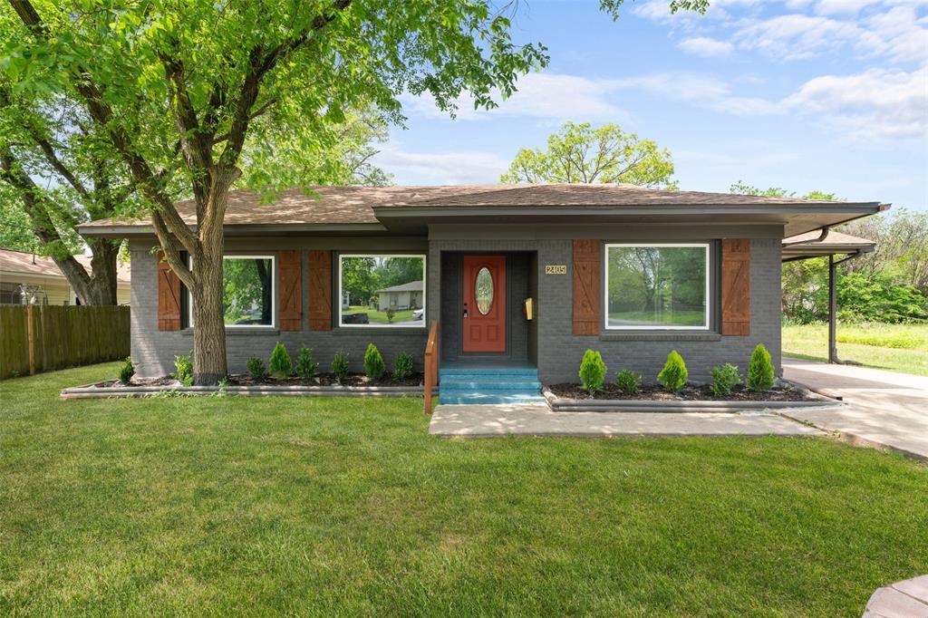 Ranch-style house with brick siding and roof with shingles