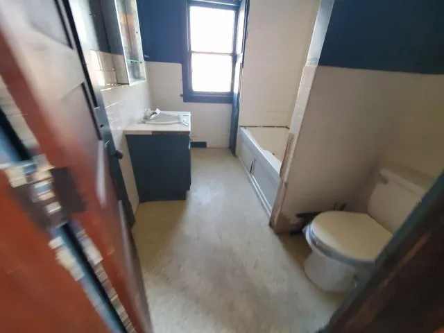 a bathroom with a sink and toilet