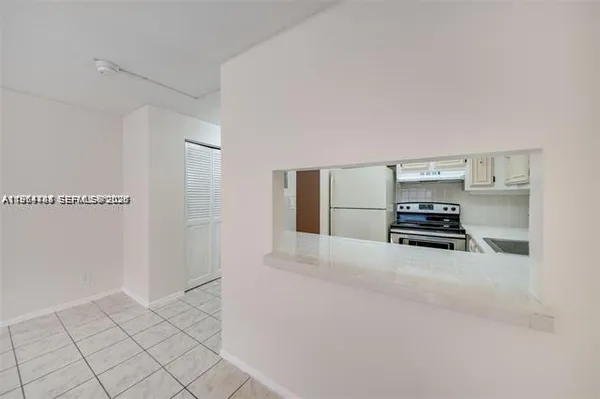 a kitchen with stainless steel appliances a refrigerator and stove