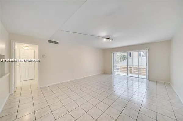 a view of an empty room with window