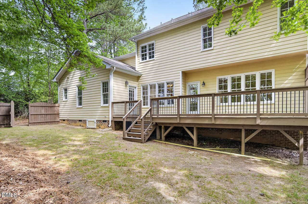 2209 Lodestar Drive Raleigh, NC 27615 - Photo 47 of 50 a house that has a wooden bench in front of it