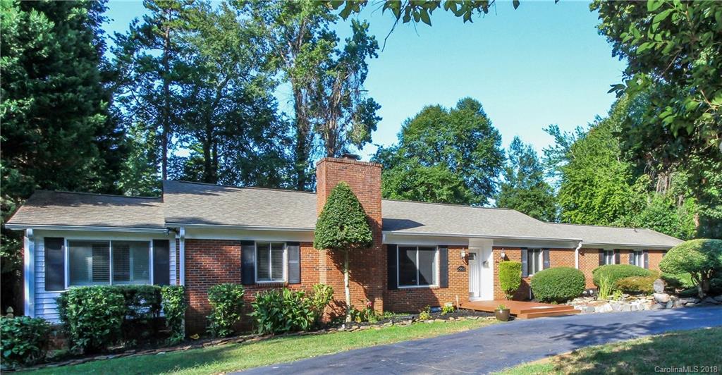 2908 Clover Road Charlotte, NC 28211 - Photo 1 of 27 a front view of a house with garden