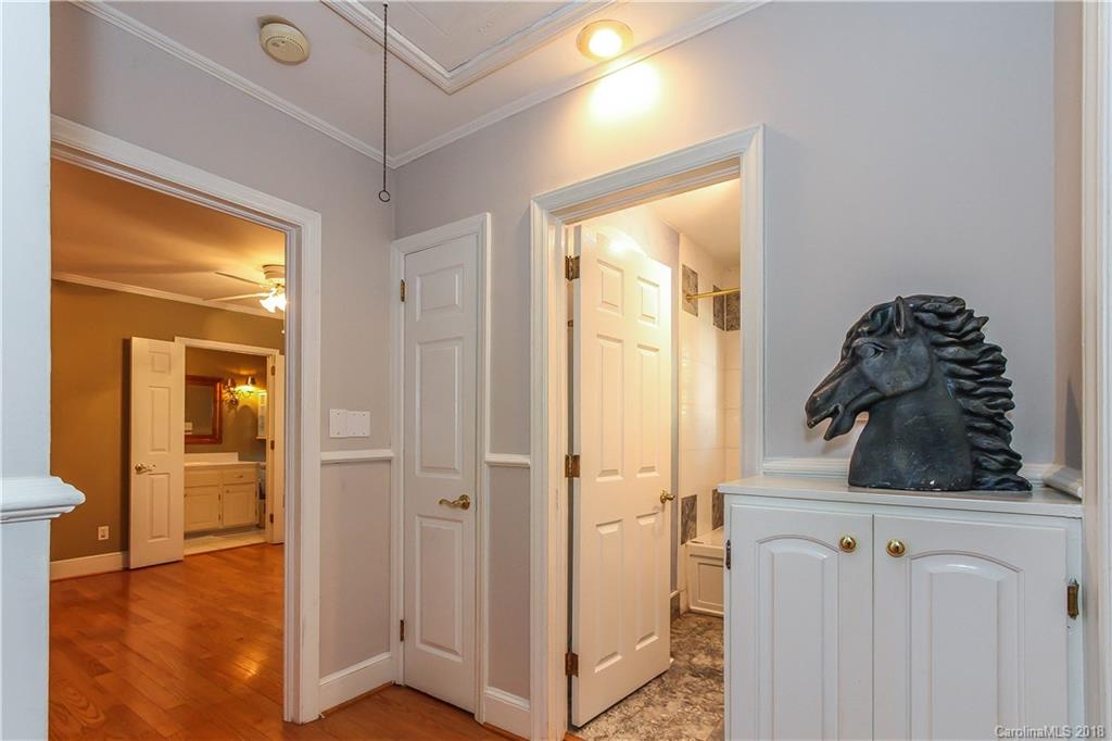 2908 Clover Road Charlotte, NC 28211 - Photo 11 of 27 a view of a closet and utility room with closet wooden floor