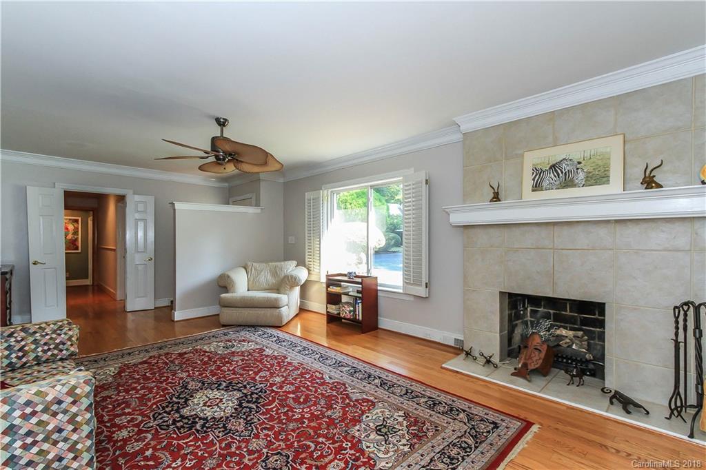 2908 Clover Road Charlotte, NC 28211 - Photo 16 of 27 a living room with furniture and a fireplace