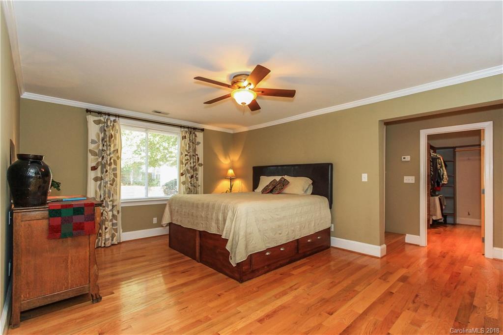 2908 Clover Road Charlotte, NC 28211 - Photo 17 of 27 a bedroom with a bed and wooden floor