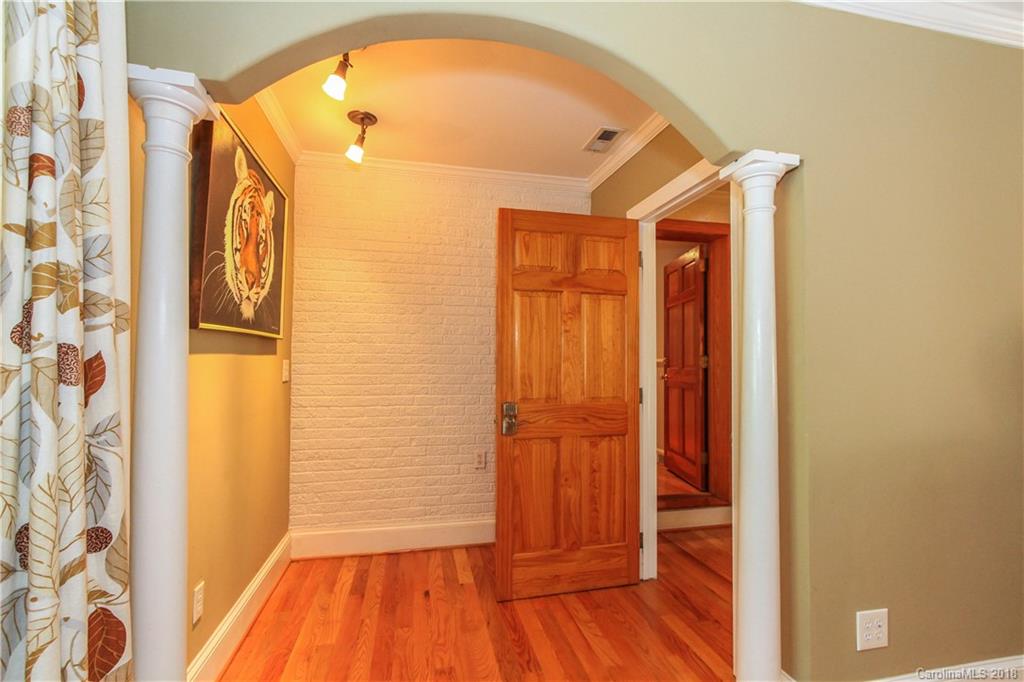 2908 Clover Road Charlotte, NC 28211 - Photo 18 of 27 a view of a hallway with wooden floor and entryway