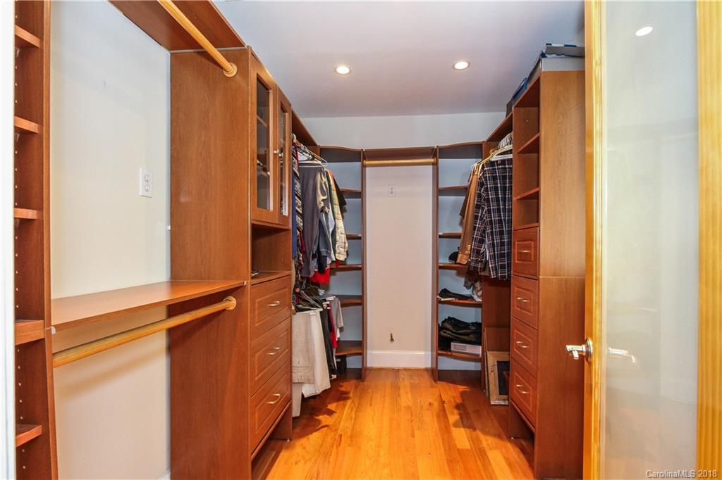 2908 Clover Road Charlotte, NC 28211 - Photo 6 of 27 a view of walk in closet with clothes and shoes