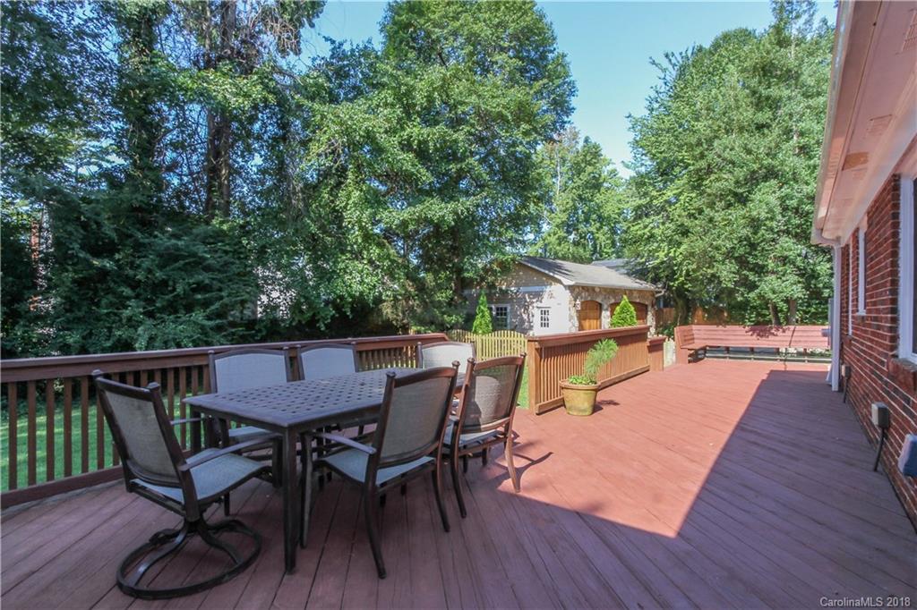 2908 Clover Road Charlotte, NC 28211 - Photo 7 of 27 a view of a patio with table and chairs with wooden floor and fence