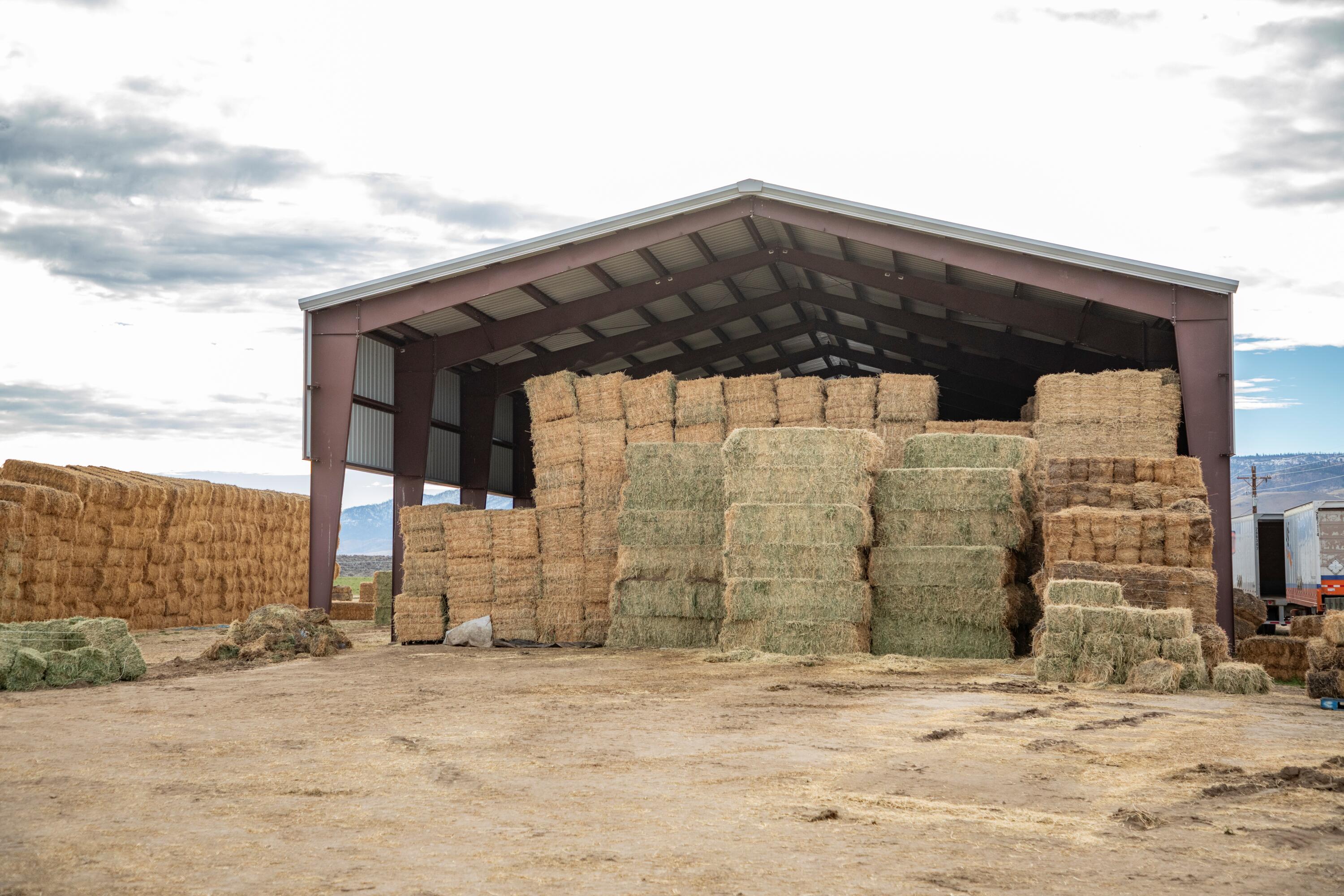 447-040 Garnier Road Herlong, CA 96113 - Photo 15 of 27 a tall building with a bench in front of it