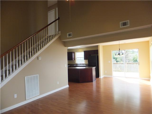 3631 Mahlon Moore Road Spring Hill, TN 37174 - Photo 2 of 15 a view of a hallway with wooden floor and staircase