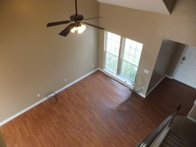 3631 Mahlon Moore Road Spring Hill, TN 37174 - Photo 4 of 15 a view of an empty room with wooden floor and a window
