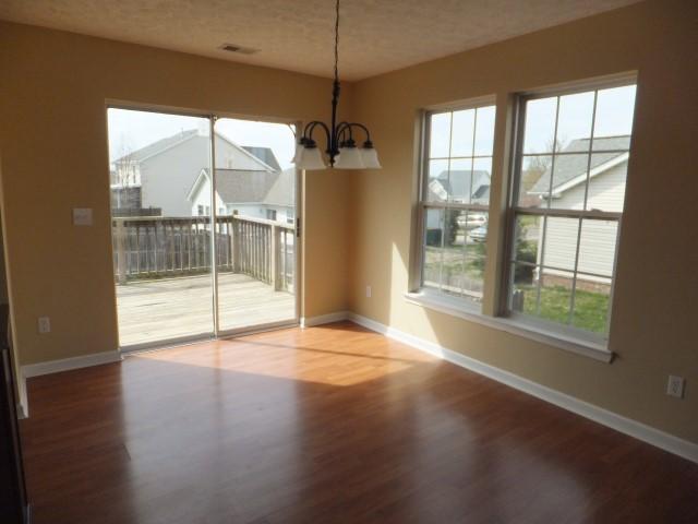 3631 Mahlon Moore Road Spring Hill, TN 37174 - Photo 7 of 15 a view of a room with wooden floor and windows