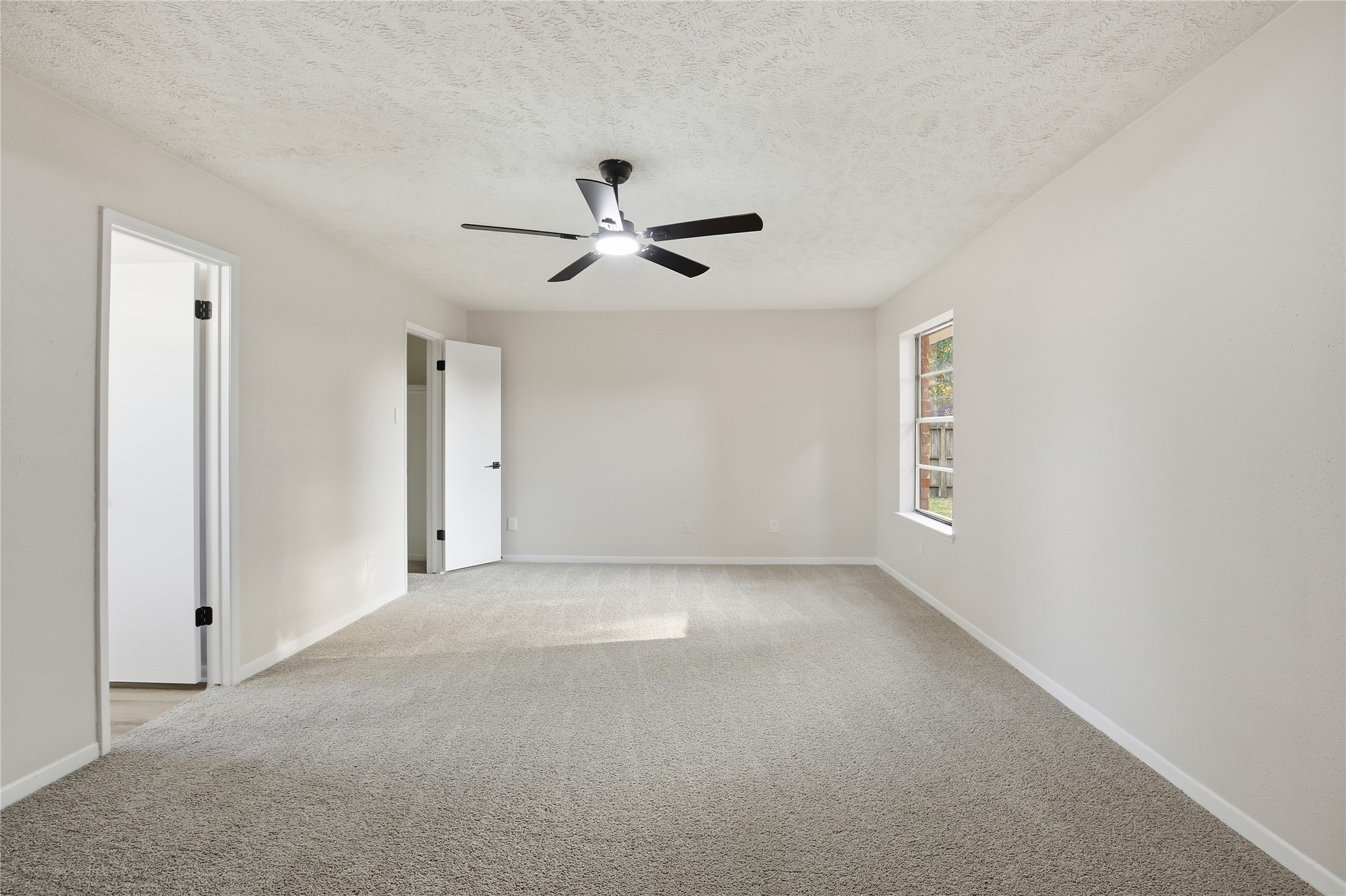 9850 Sageroyal Lane Houston, TX 77089 - Photo 11 of 18 a view of a big room with carpet