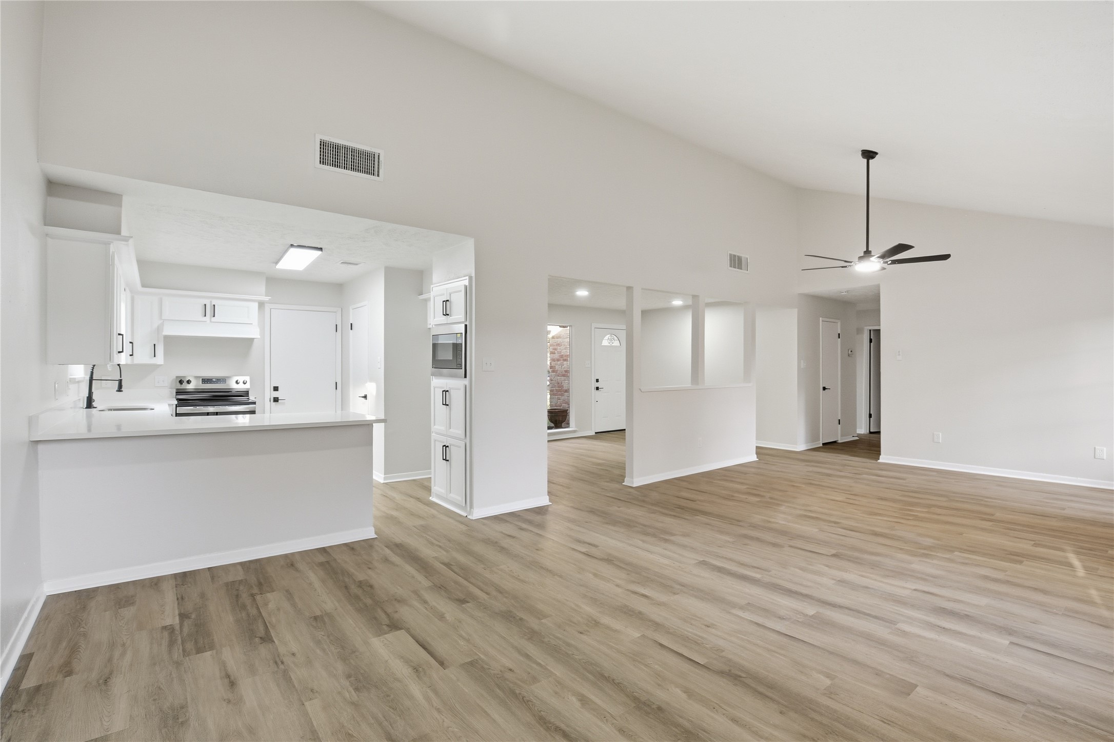 9850 Sageroyal Lane Houston, TX 77089 - Photo 10 of 18 a view of large kitchen with stainless steel appliances granite countertop cabinets and wooden floor